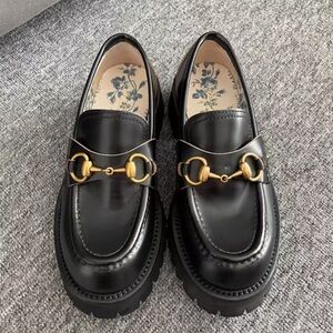 Gucci Black Loafers with Gold Accent